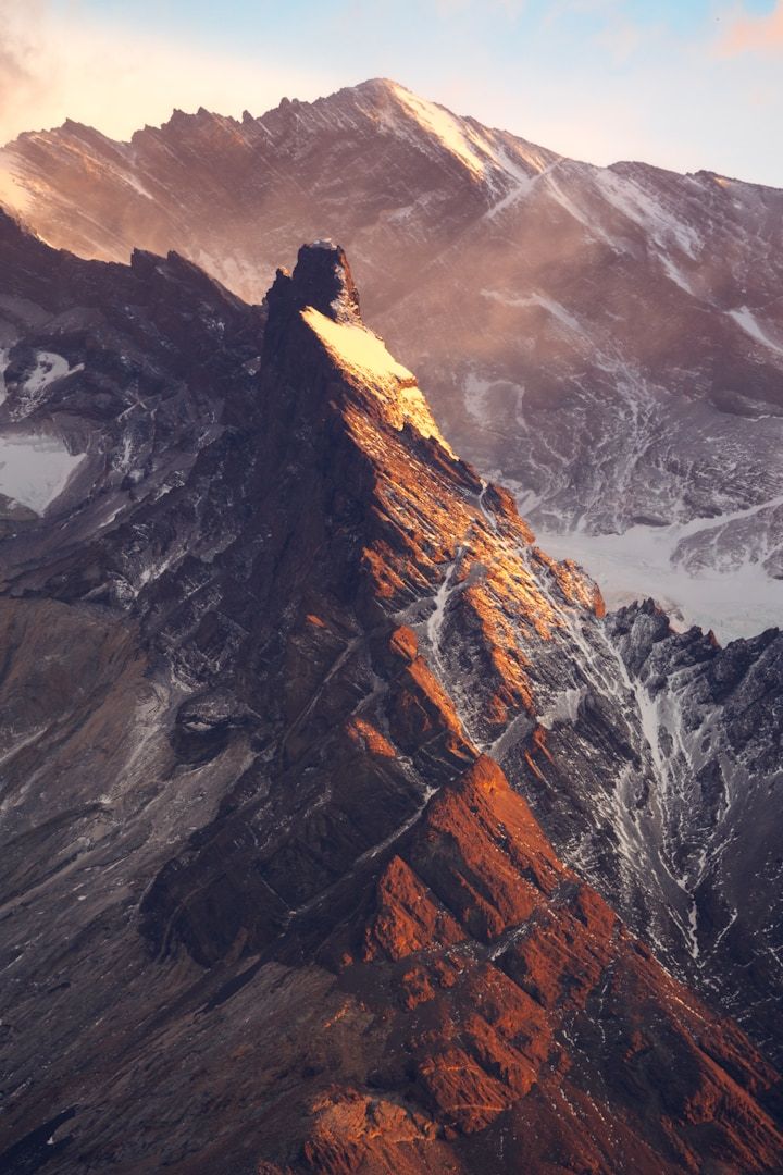 A view of a mountain with snow on it