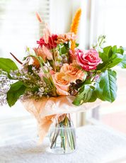 pink roses in clear glass vase
