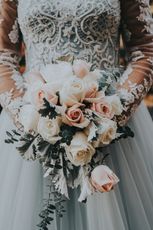 woman holding bouquet of roses