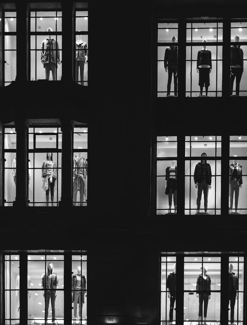 mannequin in front of windows