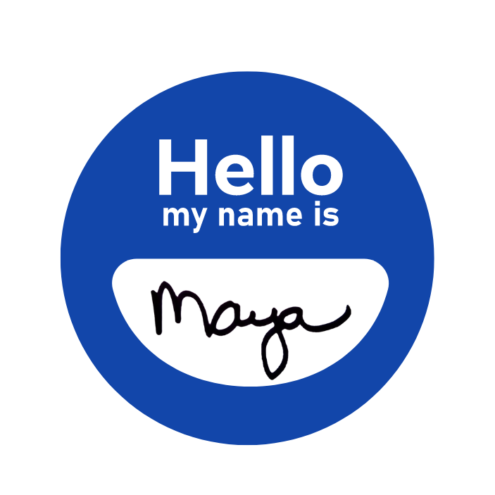 Photo of a round sticker name badge in blue with the words Hello my name is in white above a white opening smile shape