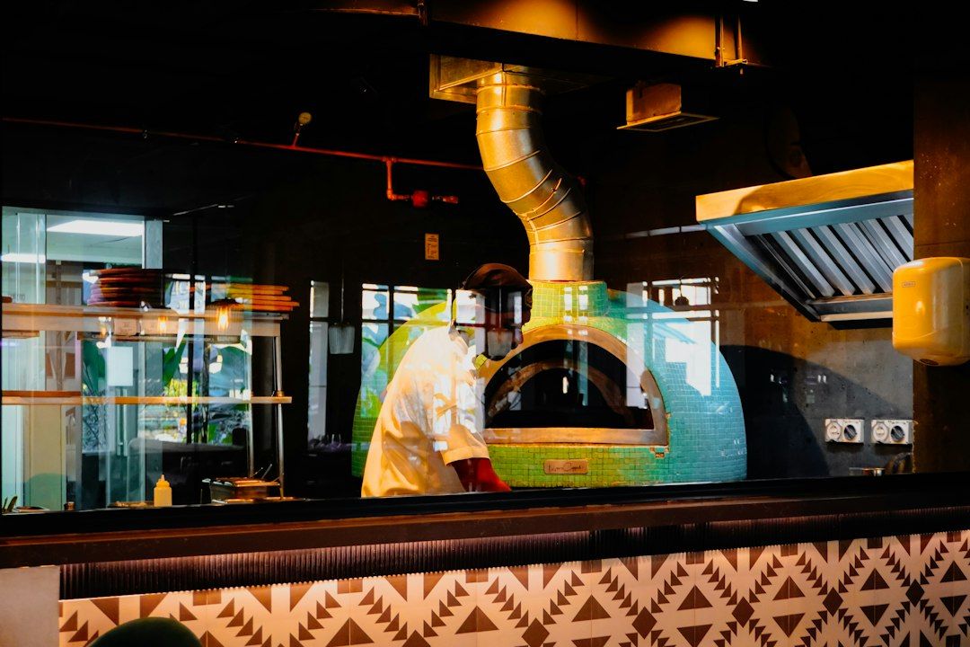 Chef working at a pizza oven