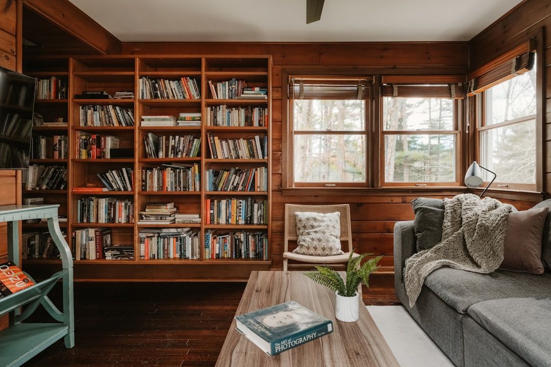 Warm living room with bookshelves and seating